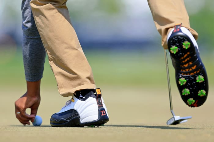 Harold Varner III's white and black Air Jordan golf shoes.